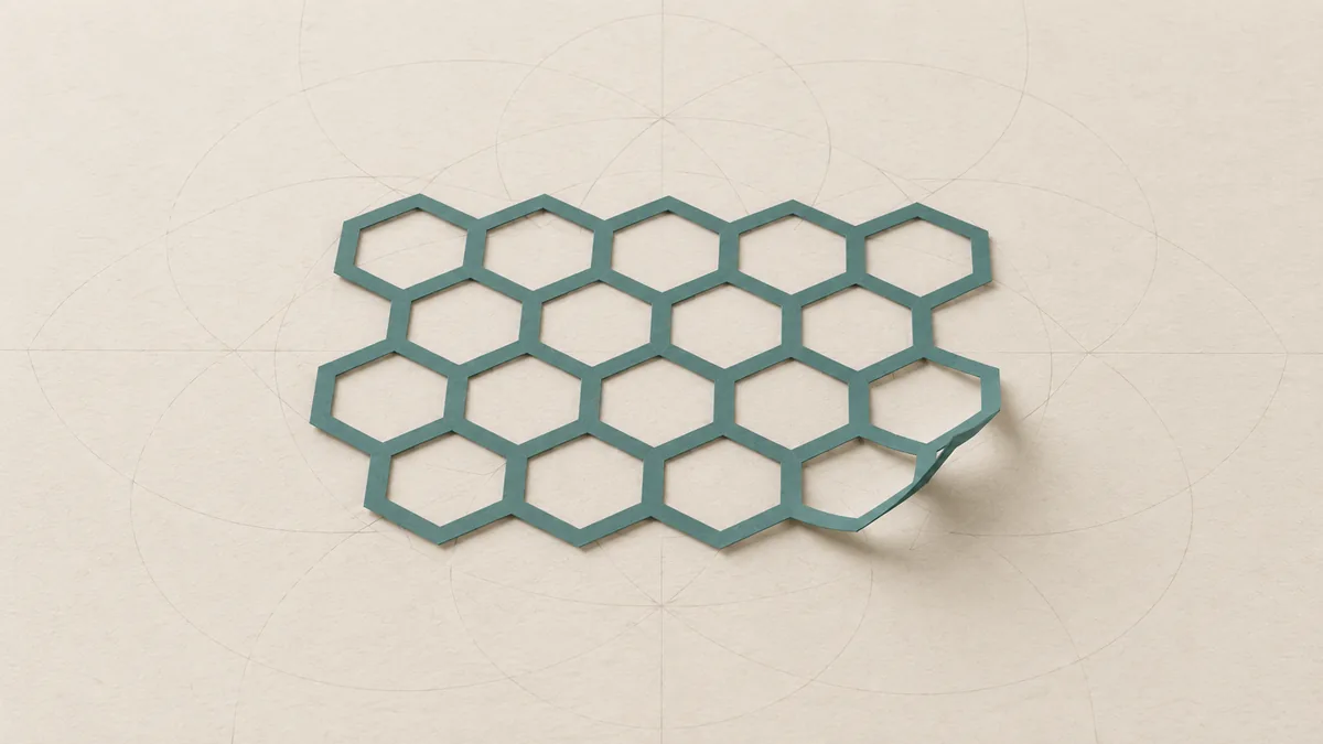 A thin cut-paper sheet of teal honeycomb mesh with one corner lifting, on warm off-white paper.